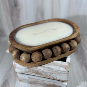 Soy and coconut wax blend candle in a unique wood vessel. Large beads carves into the wood.