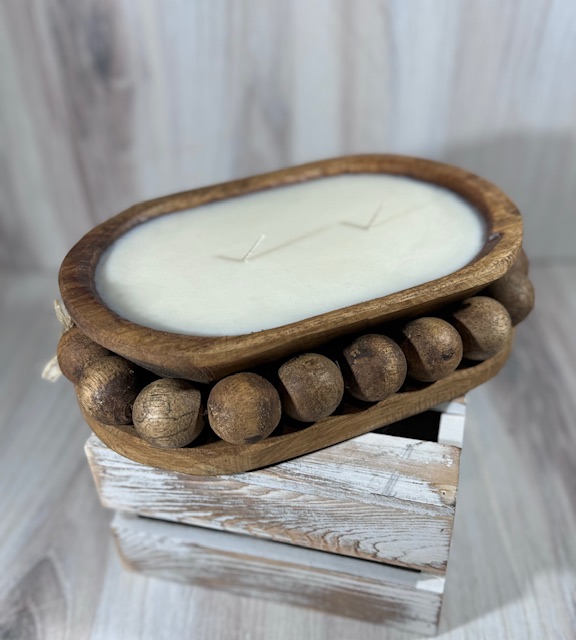 Soy and coconut wax blend candle in a unique wood vessel. Large beads carves into the wood.