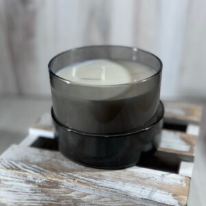 Soy and coconut wax blend candle in a round glass container with lid.