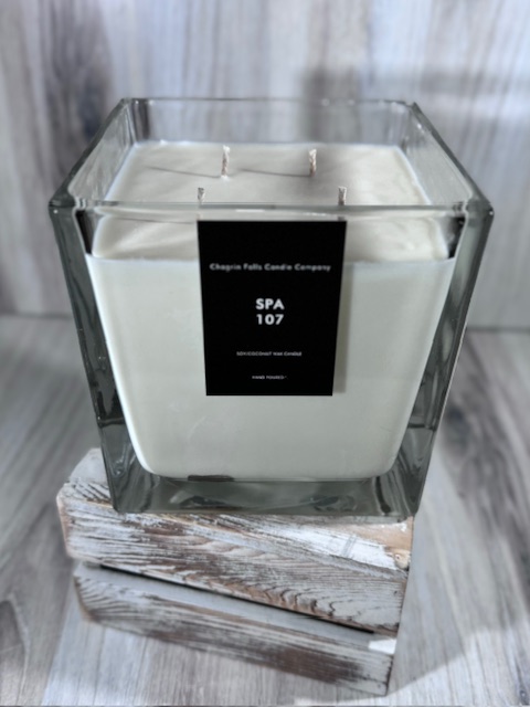 Soy and coconut wax blend candle in a square glass container
