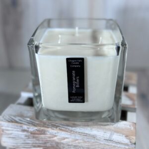 Soy and coconut wax blend candle in a square glass container