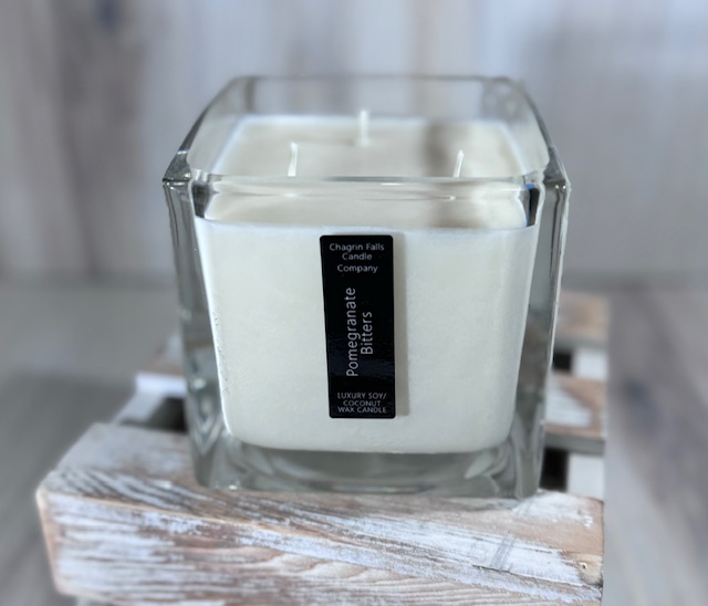 Soy and coconut wax blend candle in a square glass container
