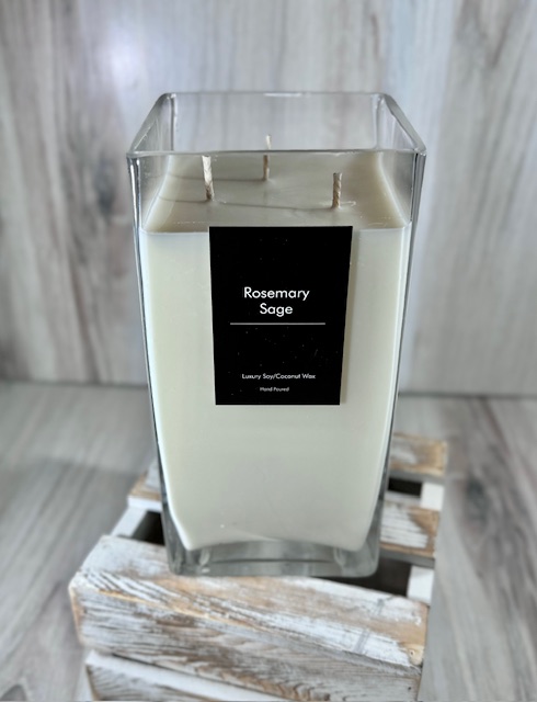 Soy and coconut wax blend candle in a tall square glass container